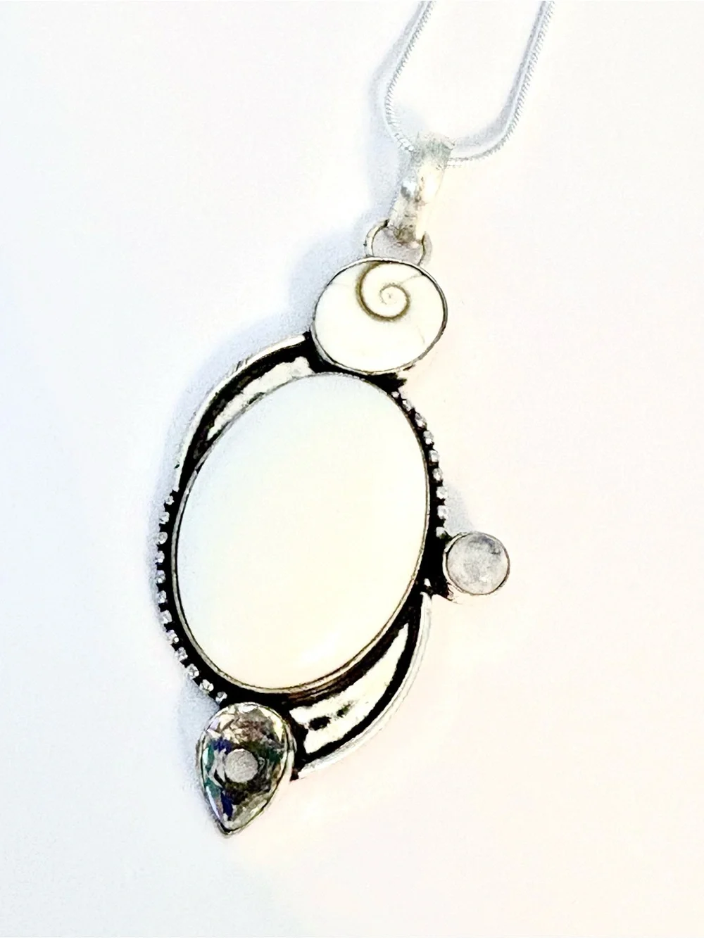 White Opal, Shiva Eye, Mystic Topaz and Moonstone pendant on silver chain.